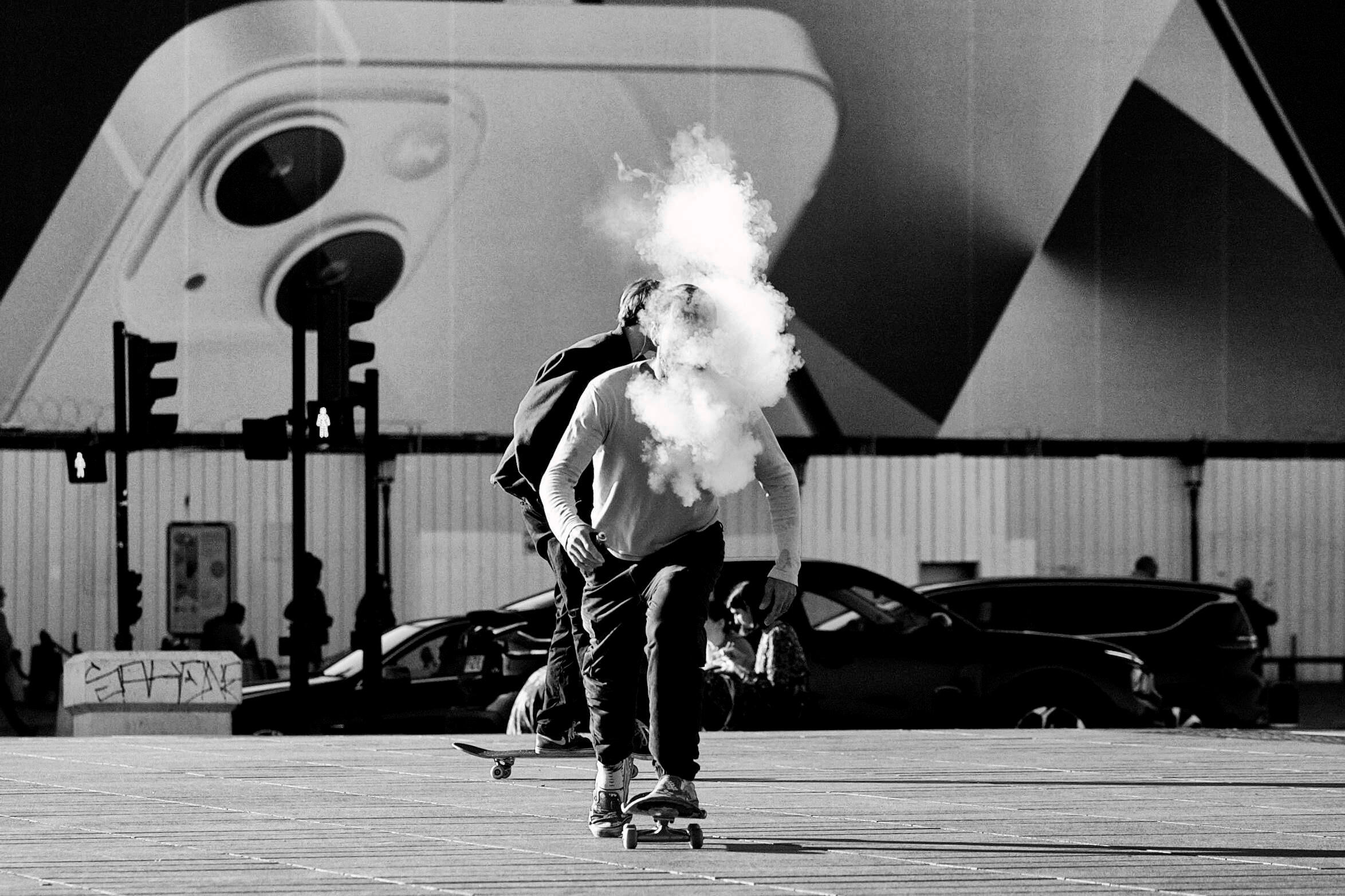 The Skater Black and white street photograph of a skateboarder surrounded by smoke in Bordeaux, by Franck Prevot.